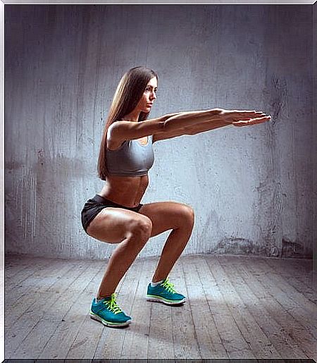 Girl performs a squat