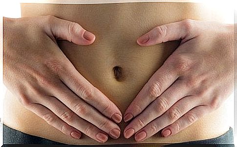 Woman with hands on belly