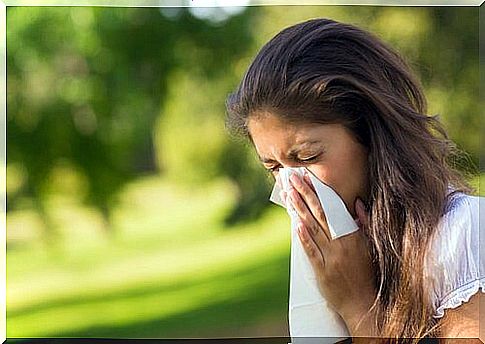 Girl blowing her nose