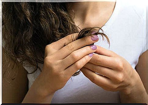 Woman touches her hair