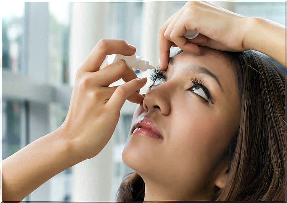 Girl putting eye drops