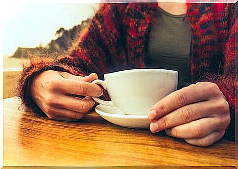 Woman with cup of coffee