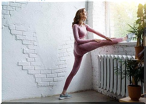 Woman performs stretches.