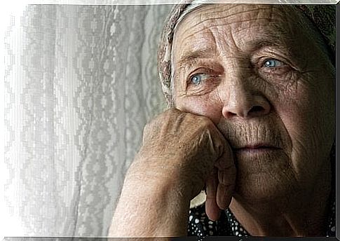 Sad elderly woman