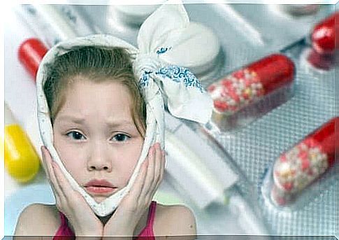 Little girl with towel on her face.