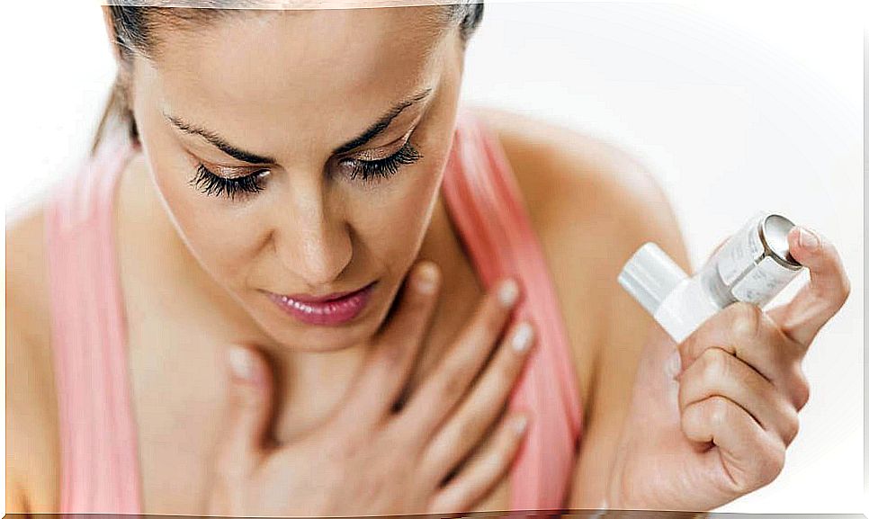 Woman with canister for asthma treatment