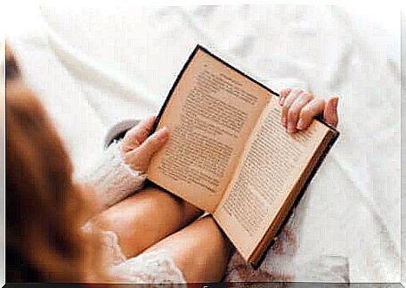 Woman reading in bed