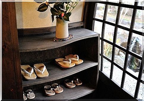 Take off your shoes and put them in a shoe cabinet