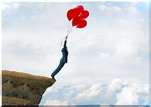 Unresolved Issues - Man on a cliff about to fly away carried by balloons